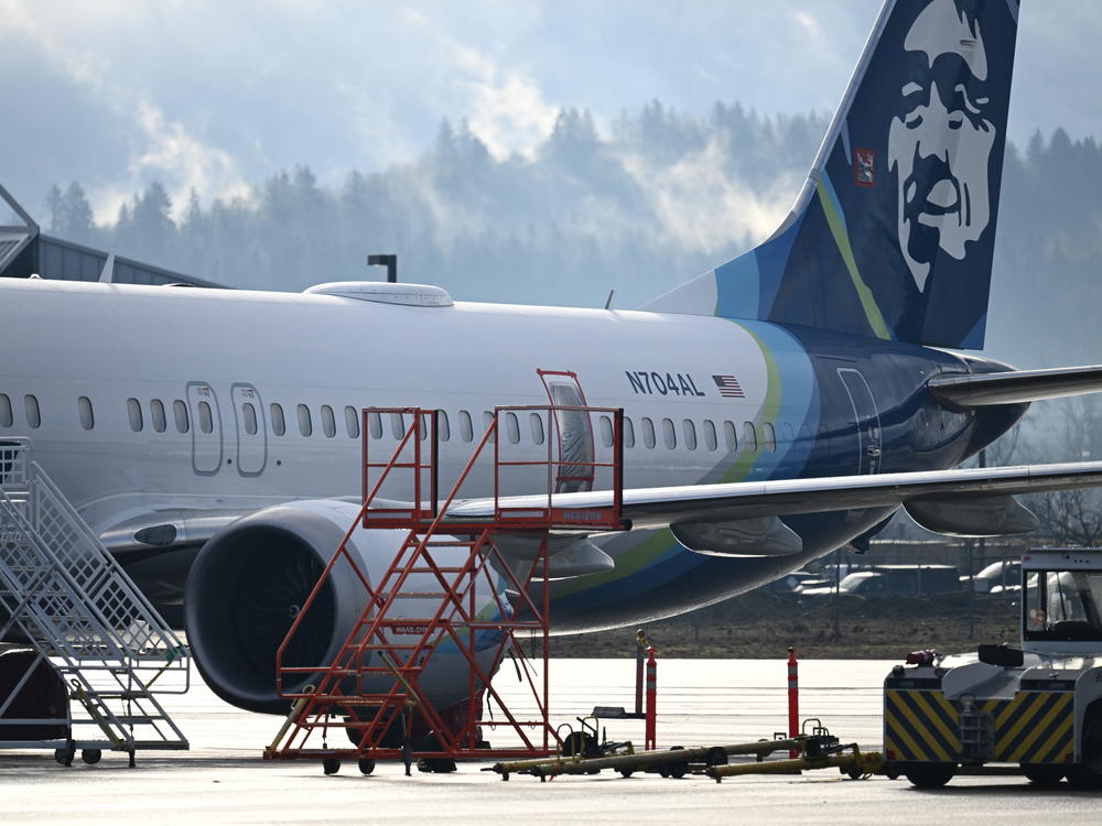 Alaska Airlines N704AL, a 737 Max 9, which made an emergency landing at Portland International Airport on Jan. 5, is parked at a maintenance hanger in Portland, Ore., this week.