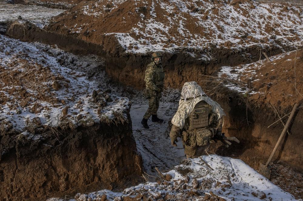 Ukrainian soldiers of the 41st Brigade walk in a trench near the front line outside Kupiansk, in Ukraine's Kharkiv region, on Jan. 23.