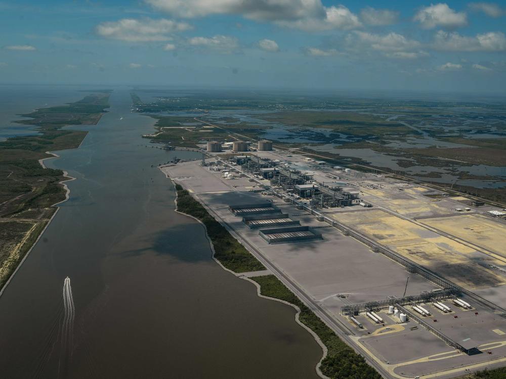 A boat sails down the Calcasieu Ship Channel past Cameron LNG, one of three liquified natural gas export plants in Cameron Parish, Louisiana.