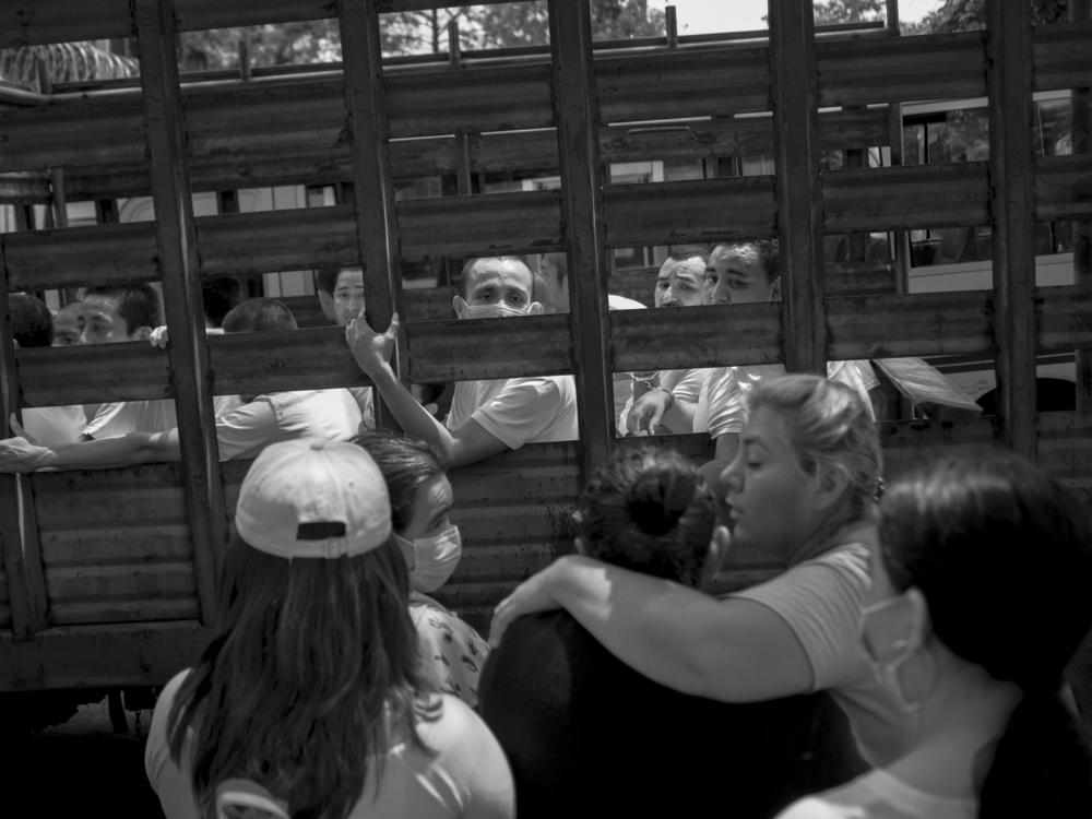 People under arrest say goodbye to their relatives outside San Salvador's Ilopango jail in September 2022.