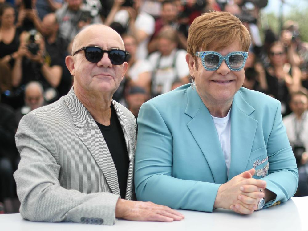 Elton John and Bernie Taupin promote the film <em>Rocketman</em> at the Cannes Film Festival in 2019.