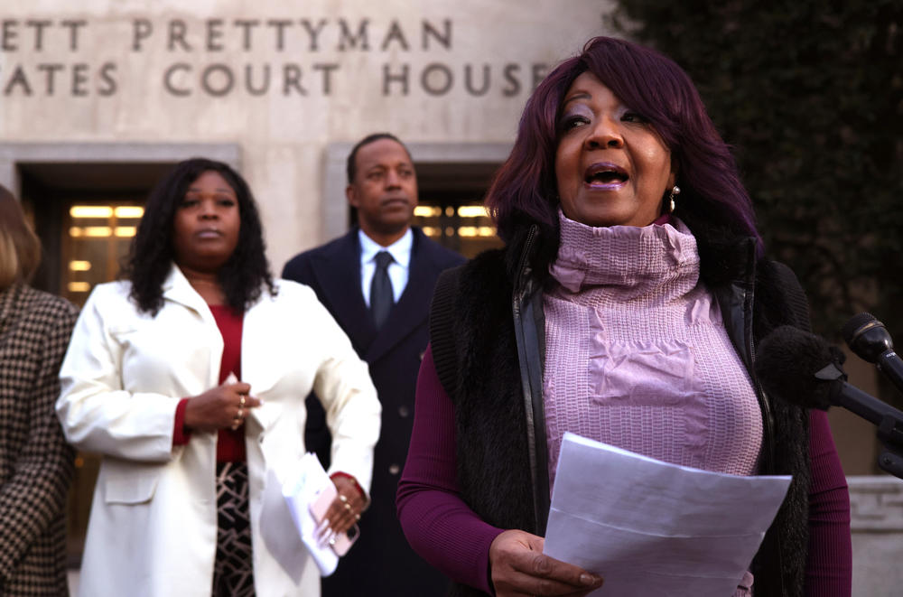 Former Georgia election workers Ruby Freeman, right, and her daughter Shaye Moss stand to speak outside of federal district court in Washington, D.C., on Dec. 15.