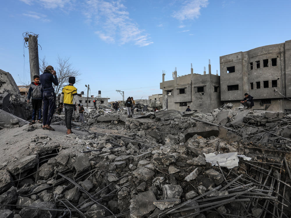 Palestinians inspect destruction after an Israeli bombing of Omar bin Abdul-Aziz Mosque in Rafah, Gaza Strip, on Thursday.