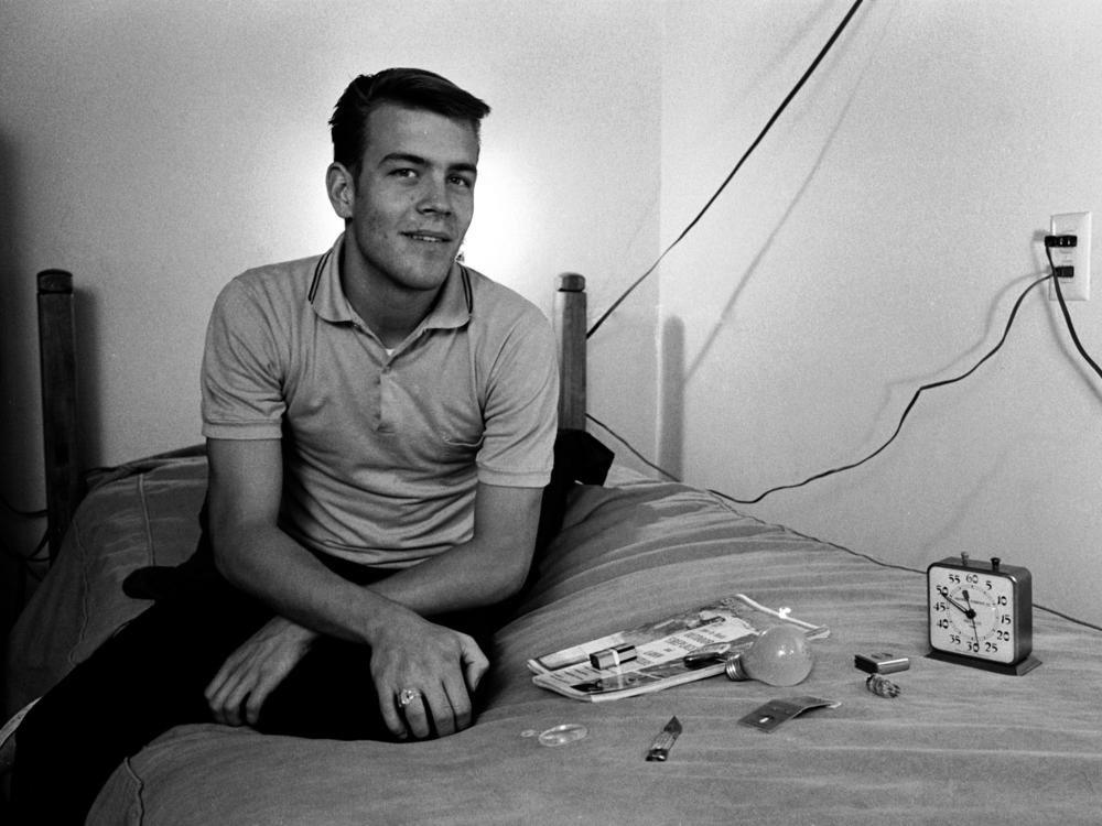 In January 1964, American student Randy Gardner sits on a bed next to various household objects he will later have to identify by memory as part of a sleep deprivation experiment in San Diego, Calif. Gardner set the world record during the experiment, staying awake for over 264 hours.