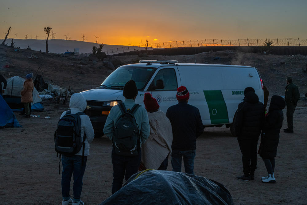 Would-be asylum seekers await processing by Border Patrol agents.