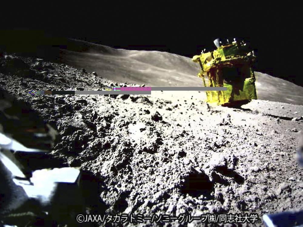 This image provided by the Japan Aerospace Exploration Agency shows an image taken by a Lunar Excursion Vehicle of a robotic moon rover called Smart Lander for Investigating Moon, or SLIM, on the moon.
