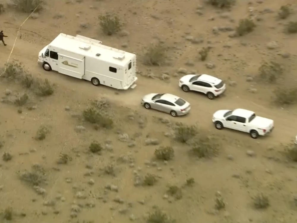This aerial image from video provided by KTLA shows law enforcement vehicles where several people were found shot to death in El Mirage, Calif., on Wednesday, Jan. 24, 2024.