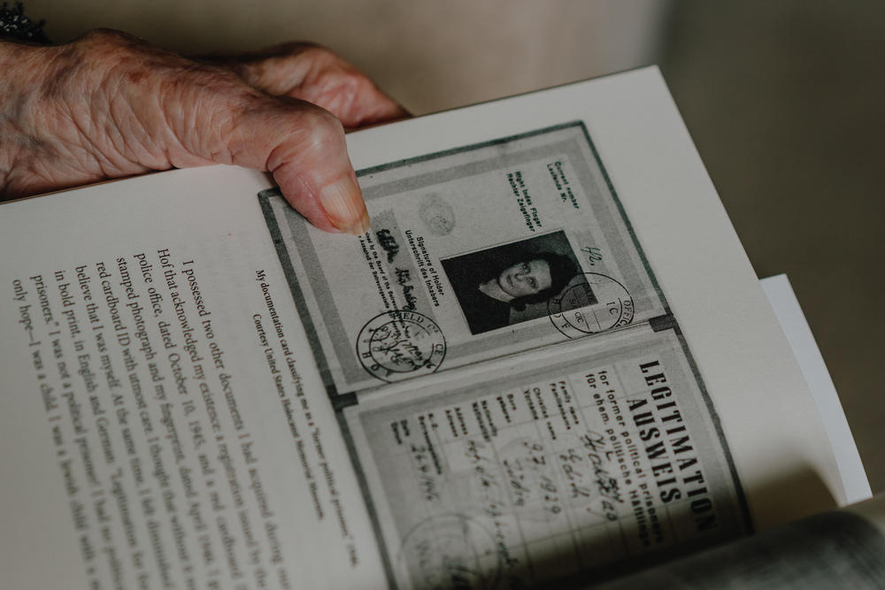 Estelle Laughlin, along with her older sister and mother, says part of the reason she survived Nazi concentration camps was the strong bond between them. The photo shows her documentation card classifying her as a 