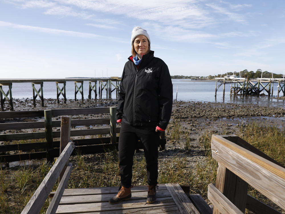 Extension agent and University of Florida researcher Savanna Barry helps oversee the newest living shoreline project in Cedar Key near G Street.