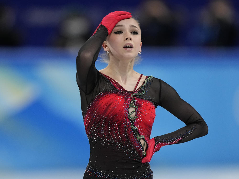 Russian figure skater Kamila Valieva reacts in the women's team free skate program during the figure skating competition at the 2022 Winter Olympics, Monday, Feb. 7, 2022, in Beijing.
