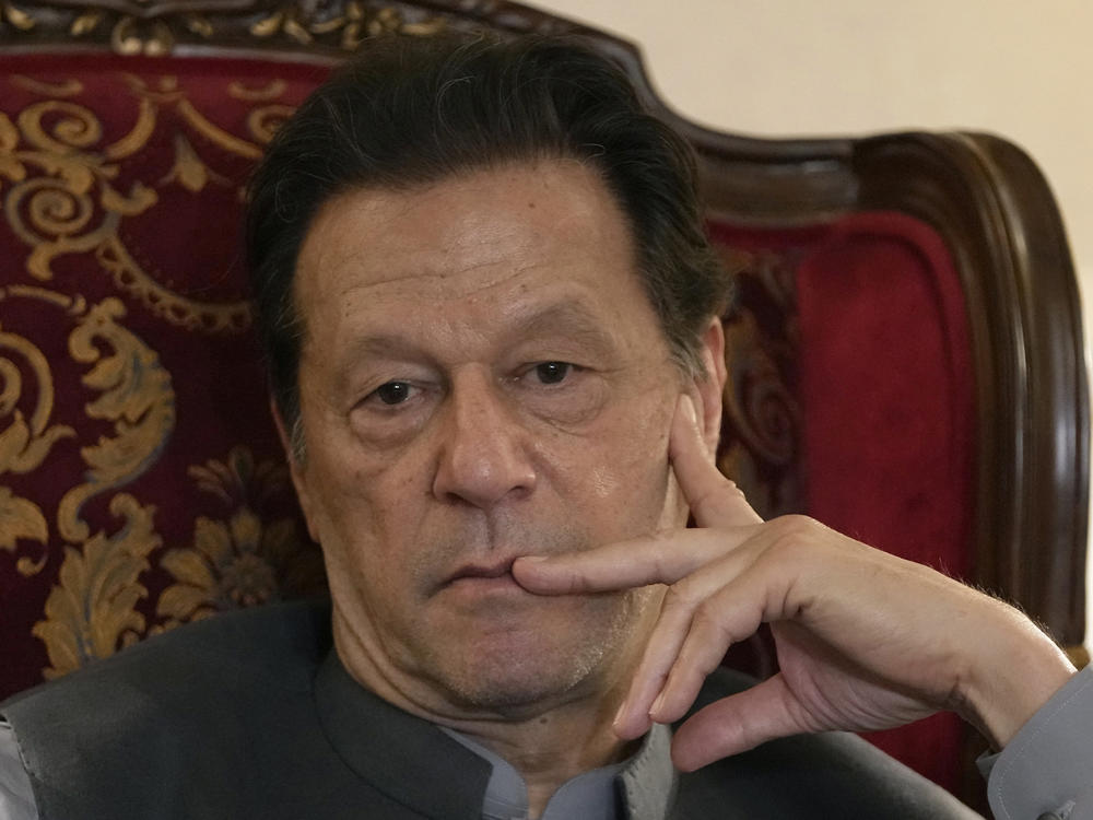 Former Prime Minister Imran Khan listens to a member of the media during a talk with reporters regarding the current political situation and the ongoing cases against him at his residence in Lahore, Pakistan, on Aug. 3, 2023.