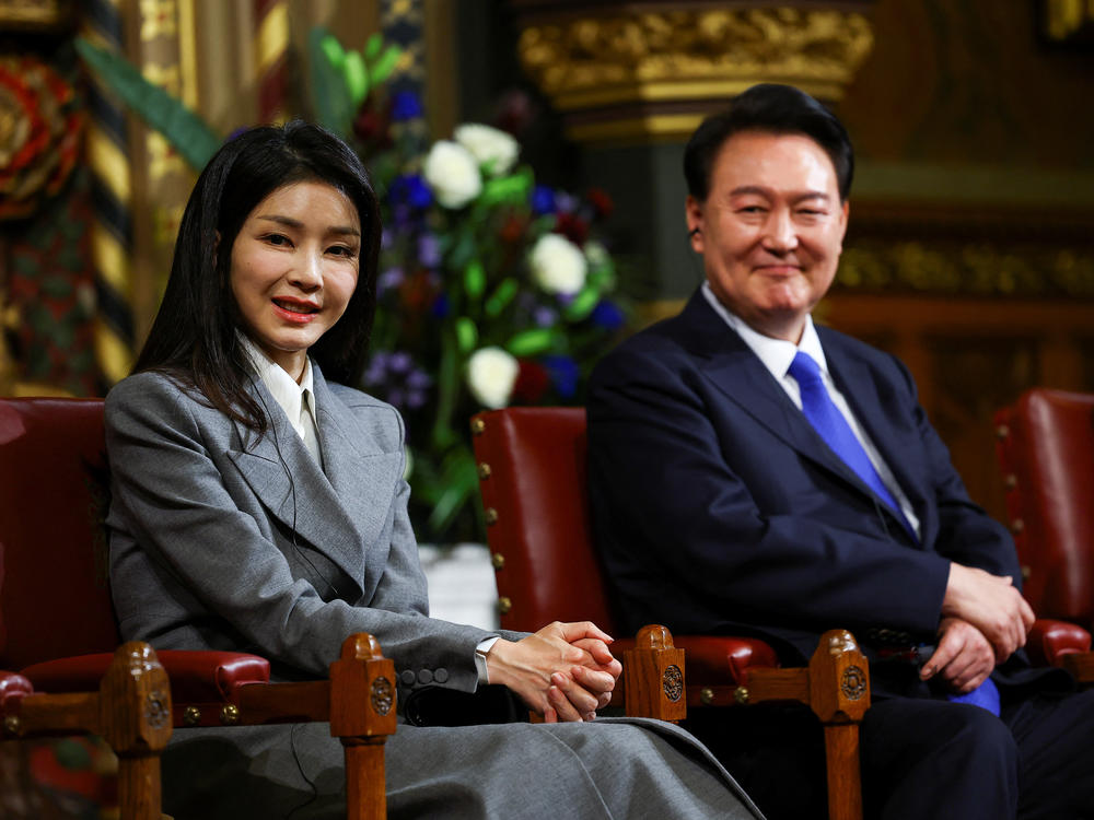 South Korea's President Yoon Suk Yeol sits with his wife Kim Keon Hee, after he addressed MPs in the Royal Gallery during a visit to the Palace of Westminster on Nov. 21, 2023 in London, England.