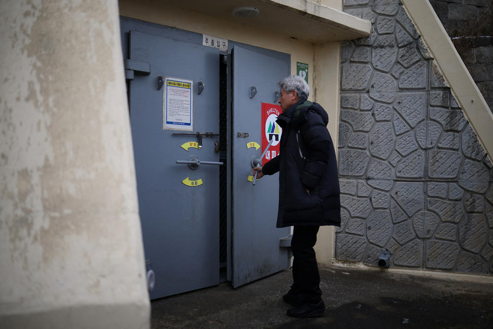 Kim Jeoung-hee, head of a residents community, opens up a shelter on Yeonpyeong Island, South Korea, on Jan. 8.
