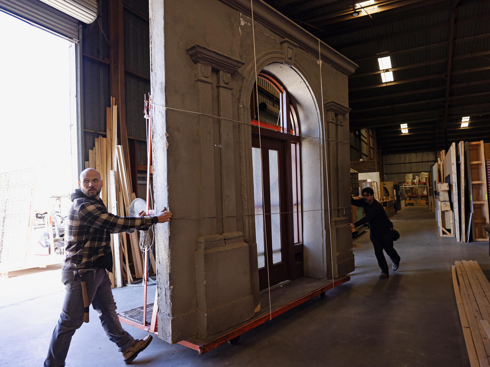 Crew members move a set piece at Beachwood Services in Santa Clarita, Calif.