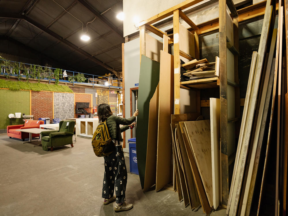 Liao shops for materials in EcoSet's aisles. When sets get too old to rent out to big-budget productions, they often wind up at places like the Los Angeles-based company.