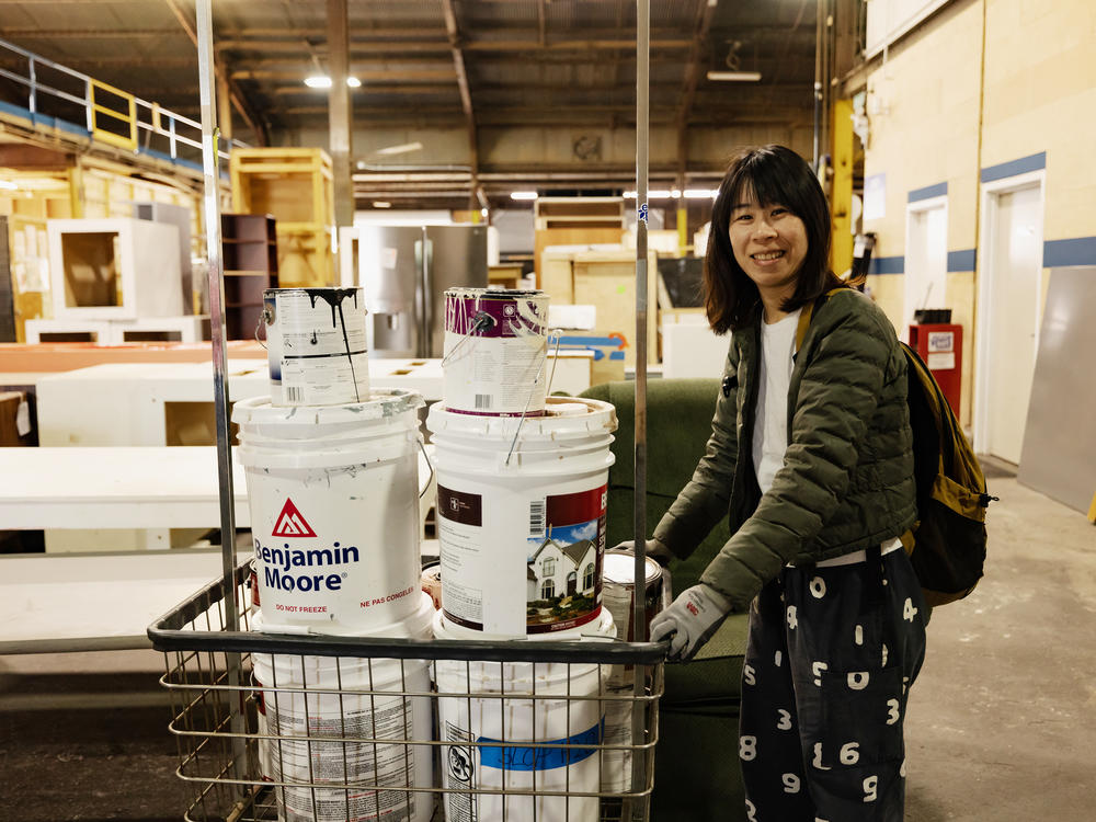 Film student Oyster Liao shops for paint at EcoSet, which will be used in an upcoming film project.