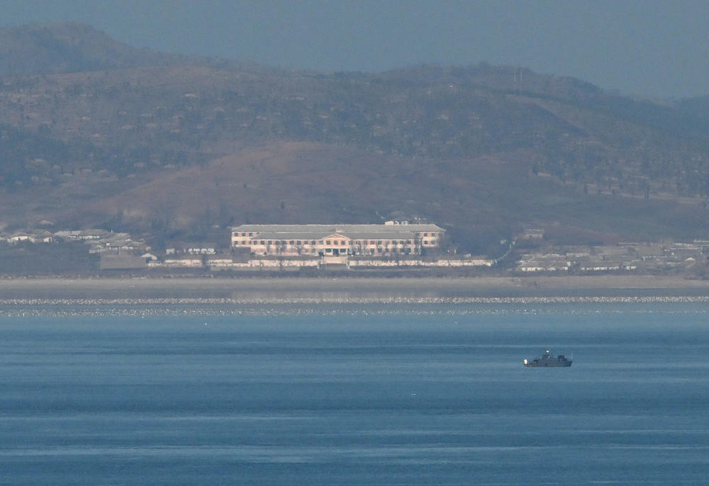 A general view shows an unidentified boat before the North Korean coastline as seen from a viewpoint on Yeonpyeong Island, near the Northern Limit Line sea boundary with North Korea, on Jan. 6.