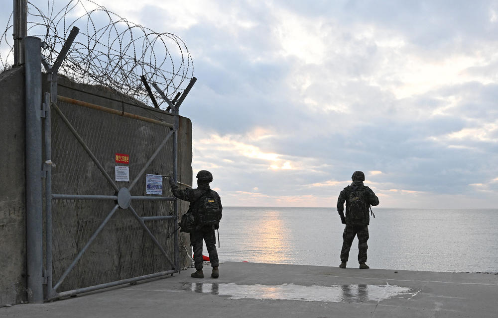 South Korean marines patrol the entrance to a beach on Yeonpyeong Island.