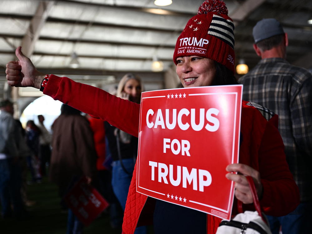 Supporters of former President Donald Trump arrive to hear him speak at a commit to caucus rally in Las Vegas on Saturday. The Nevada Republican Party is holding a caucus to determine who wins the state's GOP delegates — a contest that's two days after the state-run primary.