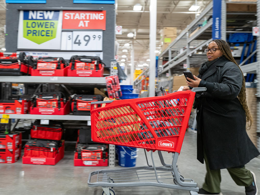 People shop at a home improvement store in Brooklyn, N.Y., on Jan. 25, 2024. The economy has been sturdier than expected over the last year while inflation has continued to ease.