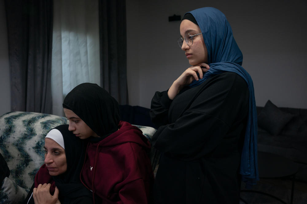 Left to right: Rawan Ali, 39, Lama Ali, 16, and Deema Ali, 18, in their home in Jalazone, a West Bank refugee camp, on Jan. 5. The father of the family, Ala Al-Din Ali, is being held by Israel in administrative detention after being arrested Oct. 12 as the whole family watched.