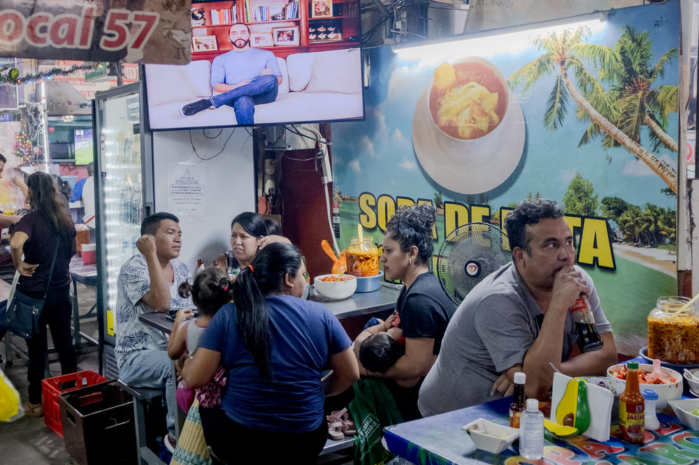 A commercial of Nayib Bukele as part of his political campaign is seen on the television in the Mercado Central in San Salvador on Jan. 31.