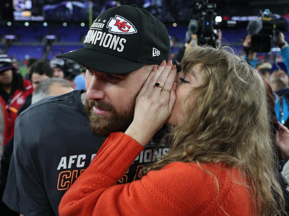 Travis Kelce of the Kansas City Chiefs celebrates with Taylor Swift after a 17-10 victory against the Baltimore Ravens in the AFC Championship Game on Jan. 28, 2024 in Baltimore.