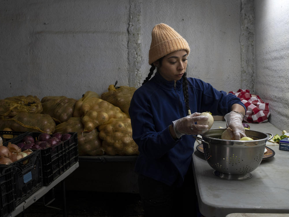 Jimena Cordero is farm manager at Ollin Farms and Mark Guttridge's daughter. She prepares veggies for an upcoming meeting to discuss Boulder County Sustainability.