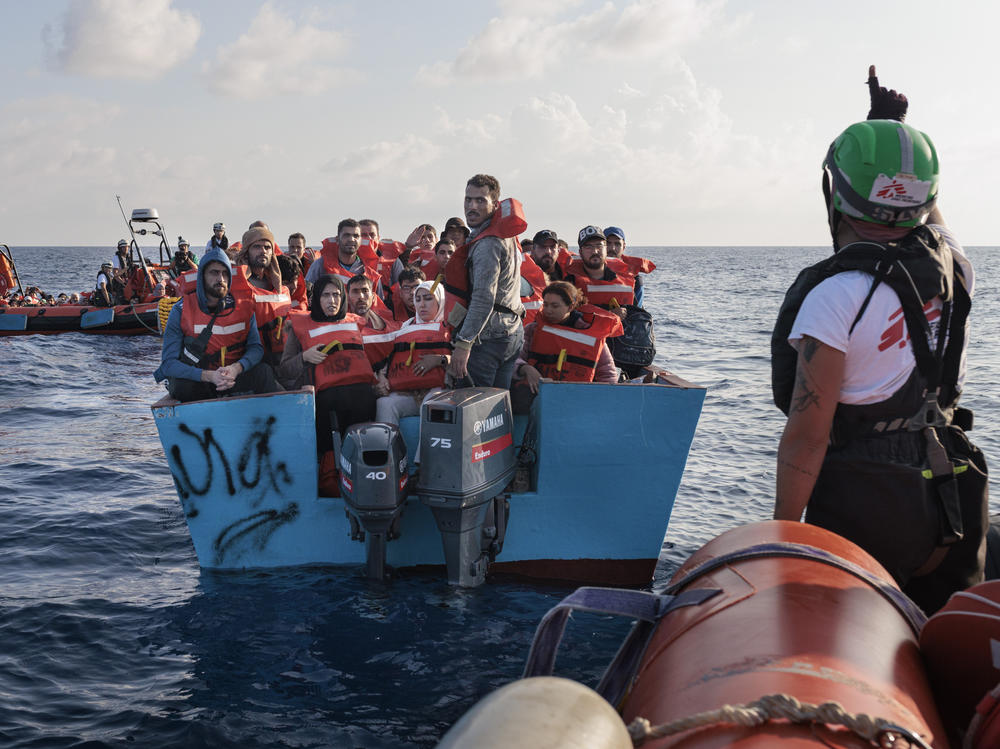 The MSF rescue team approaches a wooden boat carrying 96 migrants, mainly from Syria, Egypt, Bangladesh and Sudan. They had left the previous day from the port of Tripoli, Libya.
