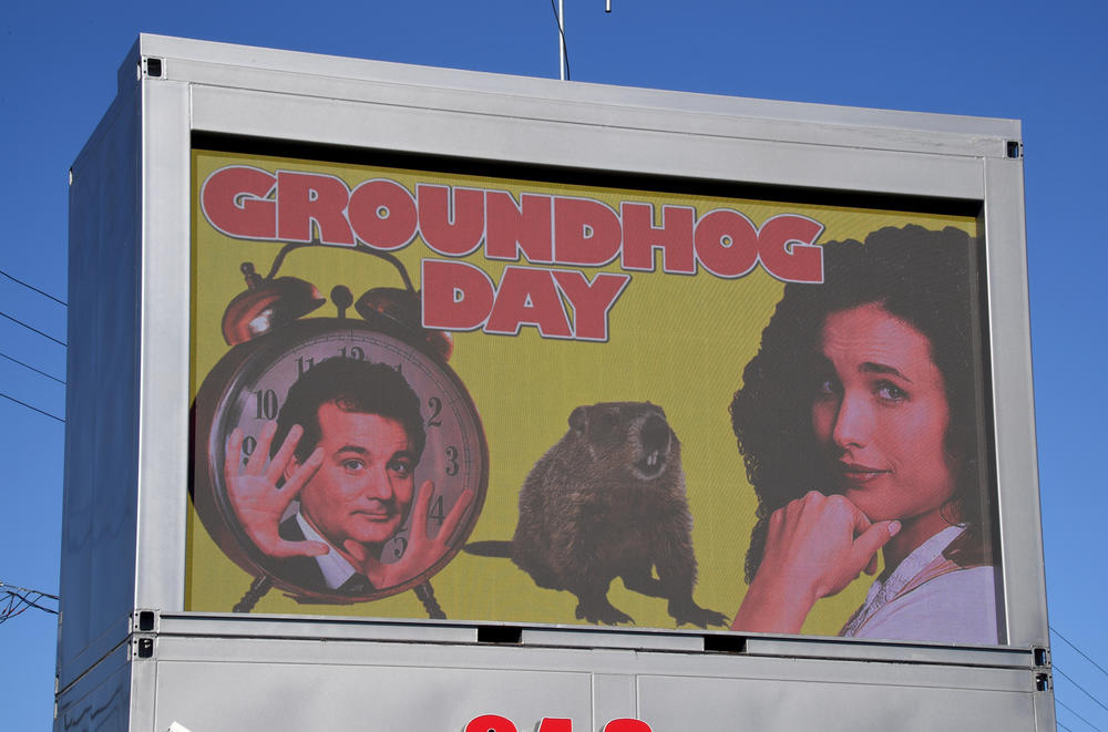A movie screen at Snappy Burger drive-thru in Las Vegas displays images of cast members Bill Murray and Andie MacDowell during a Groundhog Day celebration on Feb. 2, 2021.