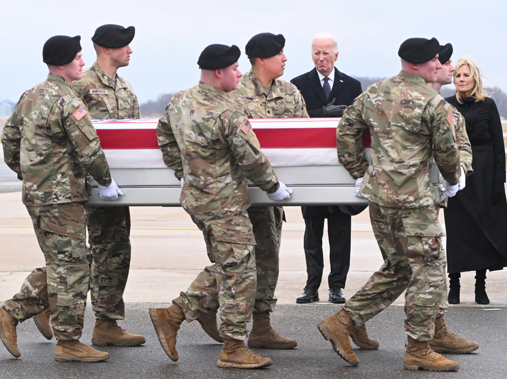 President Biden and first lady Jill Biden attend the dignified transfer of the remains of three U.S. service members killed in a drone attack on a U.S. military outpost in Jordan, at Dover Air Force Base in Delaware on Friday.