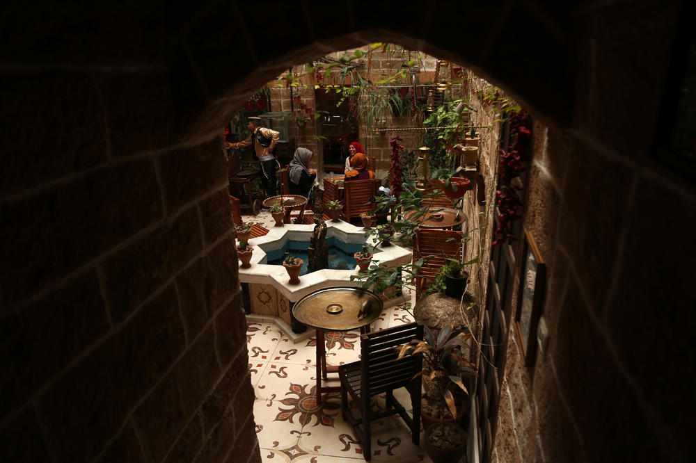 Palestinians sit inside Beit Sitti, Arabic for 