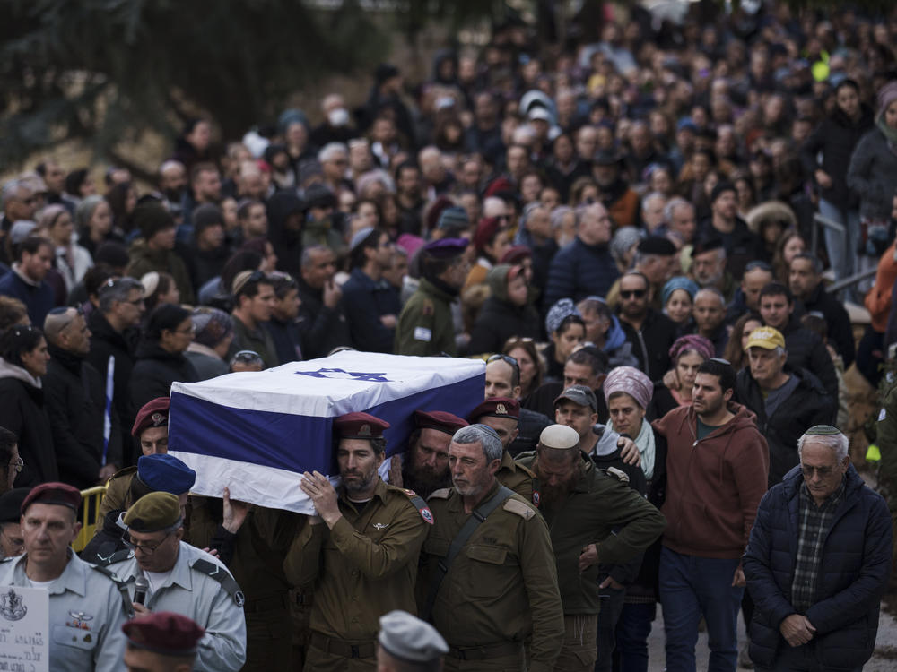 Israeli soldiers carry the flag-draped casket of reservist warrant officer Yuval Nir during his funeral at a cemetery in the West Bank settlement of Kfar Etzion on Wednesday, Jan. 31.