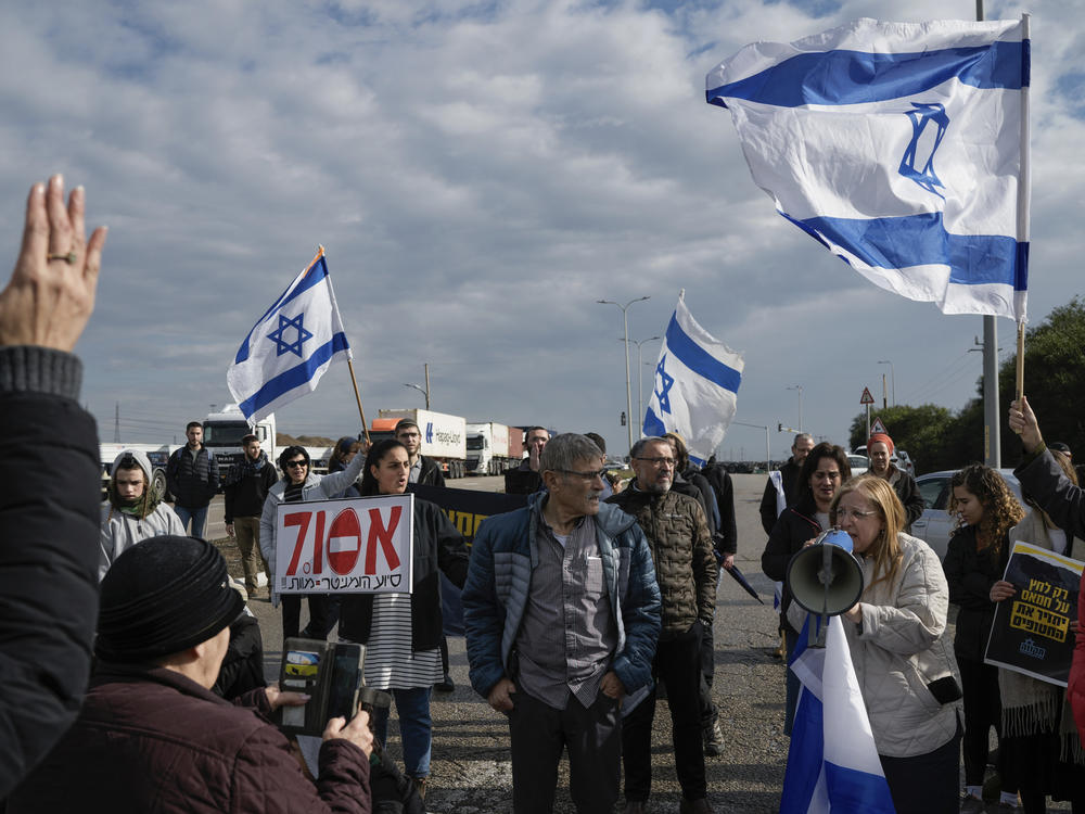 Israeli activists block the exit of Ashdod port to stop trucks carrying humanitarian aid destined for Gaza, in Ashdod, Israel, on Thursday, Feb. 1.