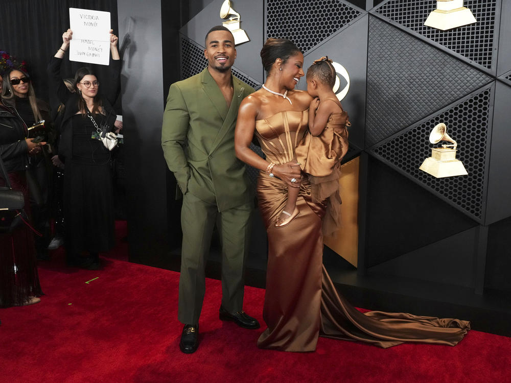 John Gaines, from left, Victoria Monét, and Hazel Monét Gaines arrive at the 66th annual Grammy Awards on Sunday, Feb. 4, 2024, in Los Angeles.
