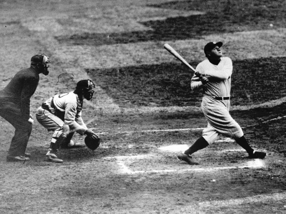 New York Yankees' Babe Ruth hits a baseball in this undated photo.