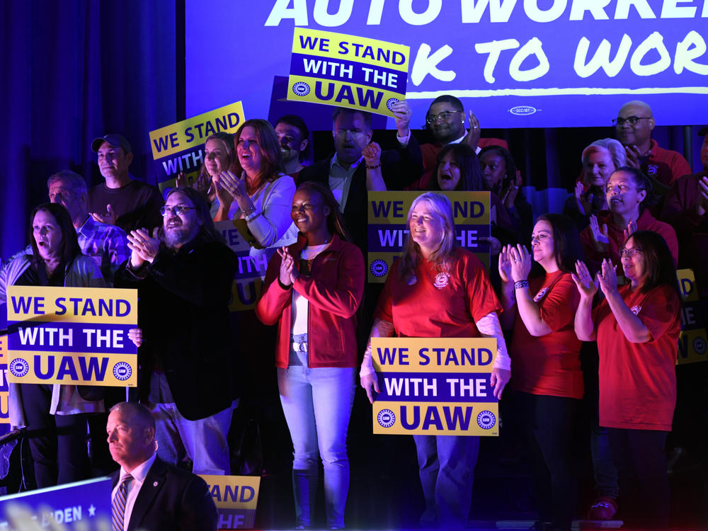 Union members listen as President Joe Biden speaks to United Auto Workers at the Community Building Complex of Boone County, on Nov. 9, in Belvidere, Ill.