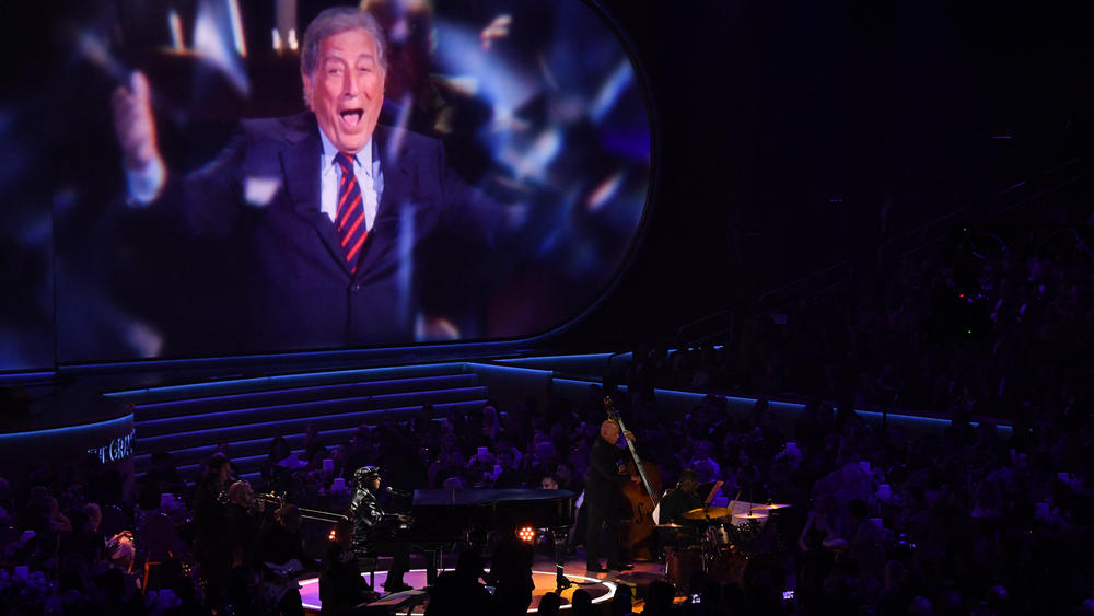 Stevie Wonder performs on stage honoring Tony Bennett during the 66th annual Grammy Awards.