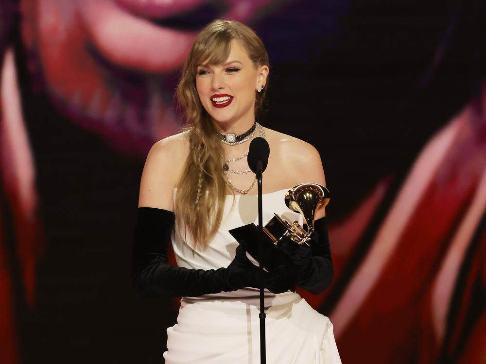 Taylor Swift accepts the best pop vocal album award for <em>Midnights</em> onstage during the 66th Grammy Awards.