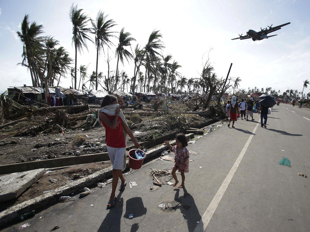 Residents of Tacloban in the central Philippines in 2013, after Typhoon Haiyan devastated the area. Scientists are renewing calls for a new Category 6 designation for the the most powerful hurricanes and typhoons, such as Haiyan.