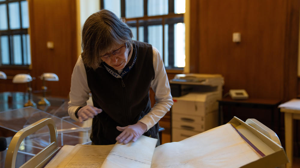 Jane Fitzgerald, a senior archivist at the National Archives, goes through the records.