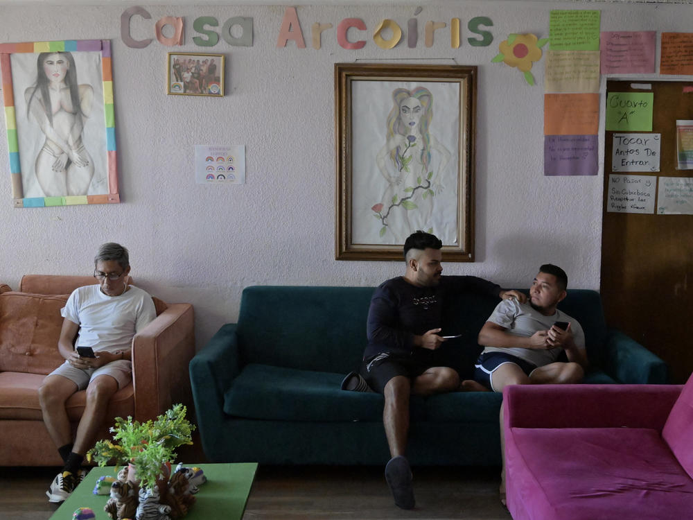 Members of the Casa Arco Iris, a LGBTQ friendly shelter in Tijuana, Mexico, hang around as they wait for news on their CBP One asylum appointments on Nov. 8 2023.