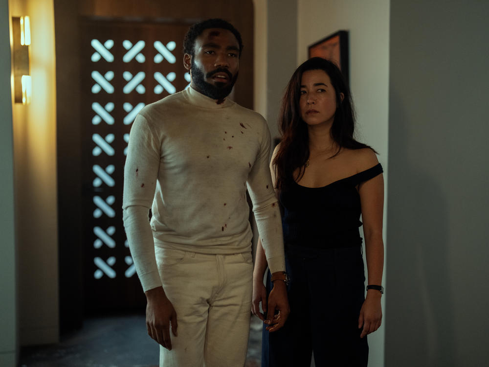 Donald Glover and Maya Erskine star in <em>Mr. & Mrs. Smith</em>.