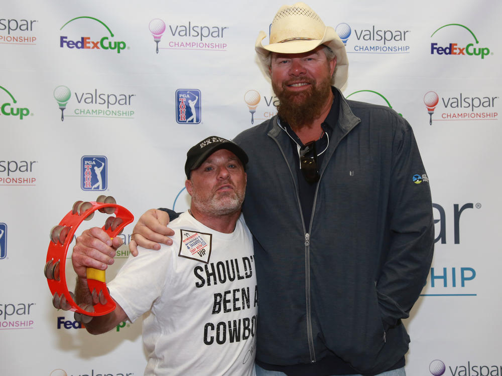 Tim McBride and Toby Keith at a VIP meet-and-greet before a concert in 2017.