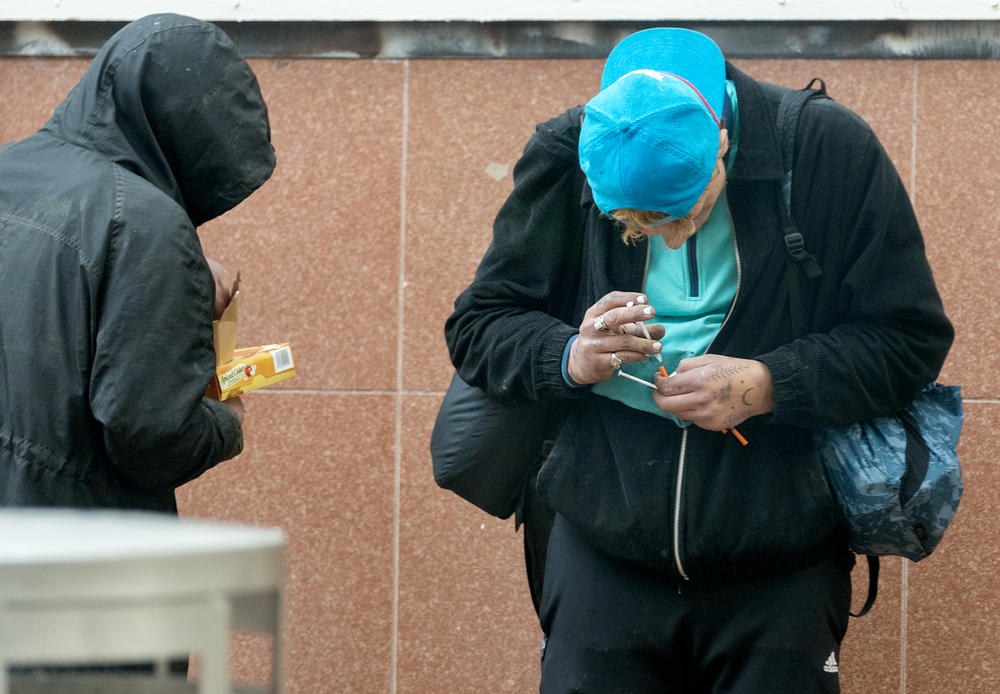 Unidentified people with drug paraphernalia in downtown Portland, Ore.