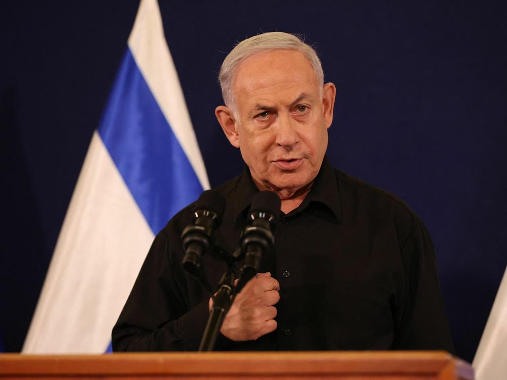 Israeli Prime Minister Benjamin Netanyahu speaks during a press conference in the Kirya military base in Tel Aviv on Oct. 28, amid ongoing battles between Israel and the Palestinian group Hamas.