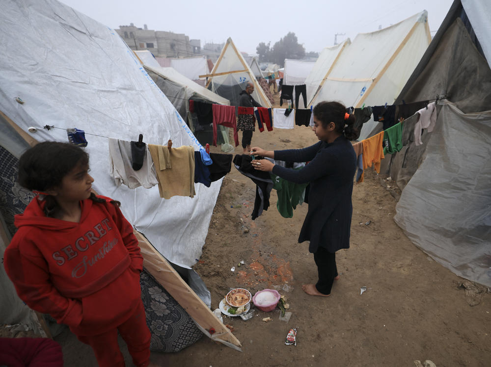People hang their laundry on makeshift shelters at a camp for displaced Palestinians in Rafah on the southern Gaza strip on Dec. 28, 2023, amid continuing battles between Israel and Hamas.