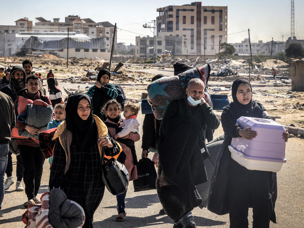 Displaced Palestinians flee from Khan Younis in the southern Gaza Strip on Jan. 30.
