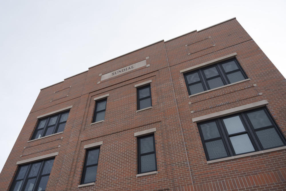 The brick facade of the Sundial Building.