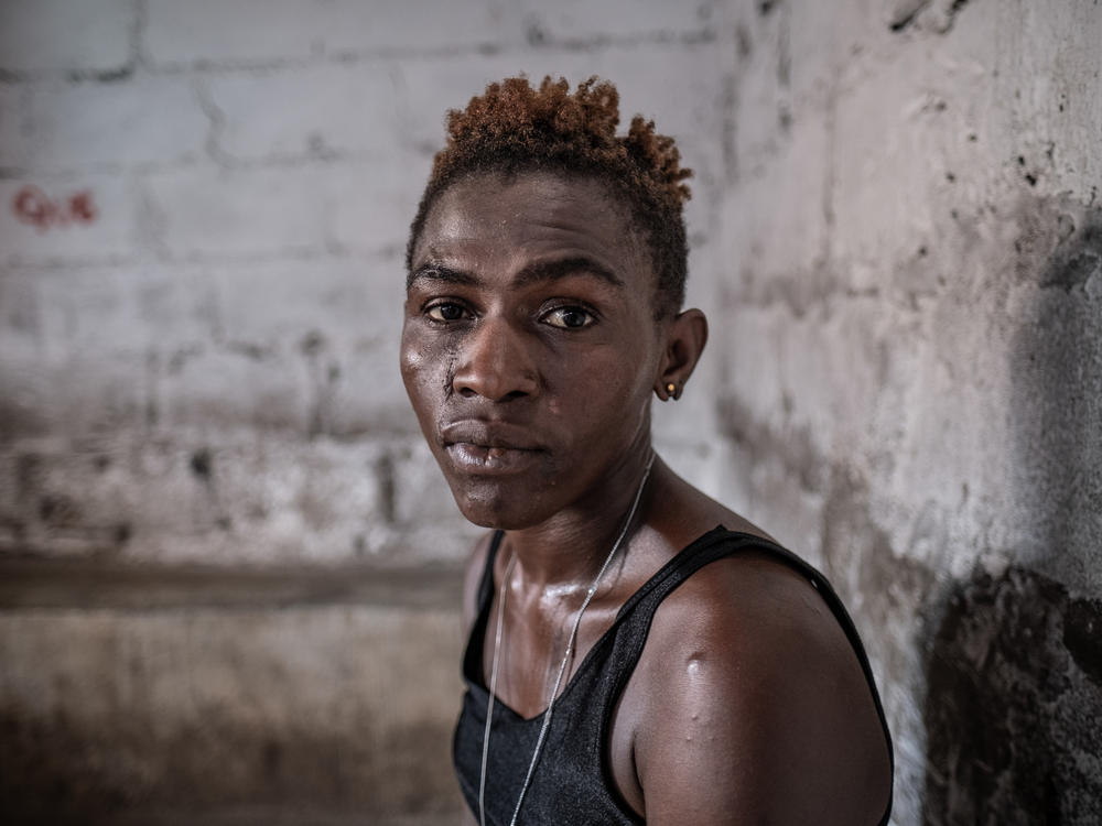 26-year-old Zainab Sankoh in a shack at the Kingtom dump site in Freetown, Sierra Leone. A self-described 